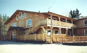 Custom designed vertical log lodge at a fly-in resort by Log and Timber Works Saskatchewan