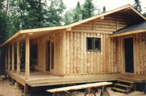 Custom designed vertical log cabin by Log and Timber Works Saskatchewan