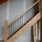 Timber frame stairs, post and railing in a timber frame home by Log and Timber Works Saskatchewan