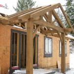 Timber frame porch entry on a home by Log and Timber Works Saskatchewan