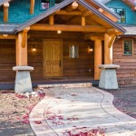 Custom designed oceanfront luxury log hybrid home entrance by Log and Timber Works British Columbia