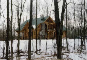 Log home in the woods by Log and Timber Works Saskatchewan