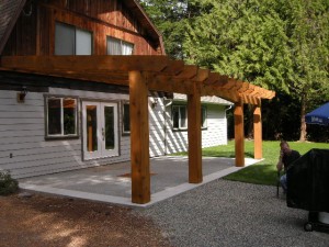 Timber frame porch addition on house by Log and Timber Works Saskatchewan