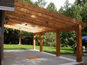 Timber frame porch addition by Log and Timber Works