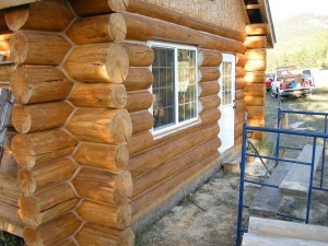 Completed restoration and refinishing of a log cabin by Log and Timber Works Saskatchewan