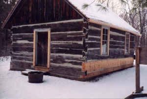 Restoration of a heritage log dovetail cabin with log replacement by Log and Timber Works Saskatchewan