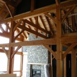 Interior of a custom designed lakefront timber frame home under construction by Log and Timber Works Saskatchewan