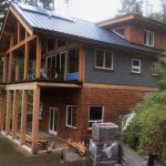 Custom designed lakefront timber frame home under construction by Log and Timber Works Saskatchewan