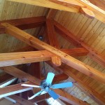 Timber framed scissors trusses roof system in a timber frame home by Log and Timber Works Saskatchewan