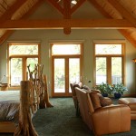 Finished master bedroom in a timber frame home by Log and Timber Works Saskatchewan