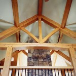 Timber frame truss in a custom designed timber frame home by Log and Timber Works