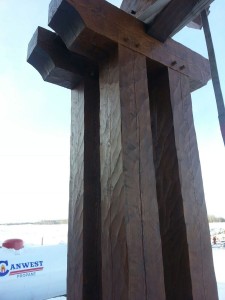 Custom designed timber cluster post with adzed finish by Log and Timber Works British Columbia