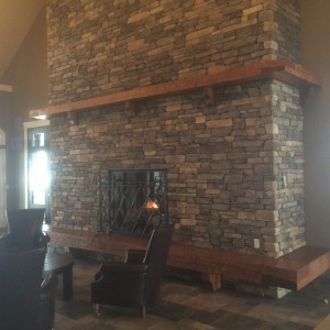 Timber frame hearth and mantel by Log & Timber Works, Saskatchewan