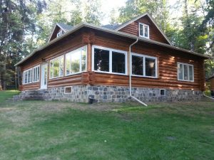 Refinished and chinked log home by Log & Timber Works Saskatchewan