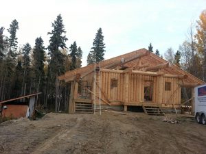 Vertical log home by Log & Timber Works Saskatchewan