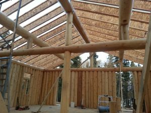 Vertical log home by Log & Timber Works Saskatchewan
